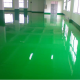 Dry-spreading wear-resistant floor hardener